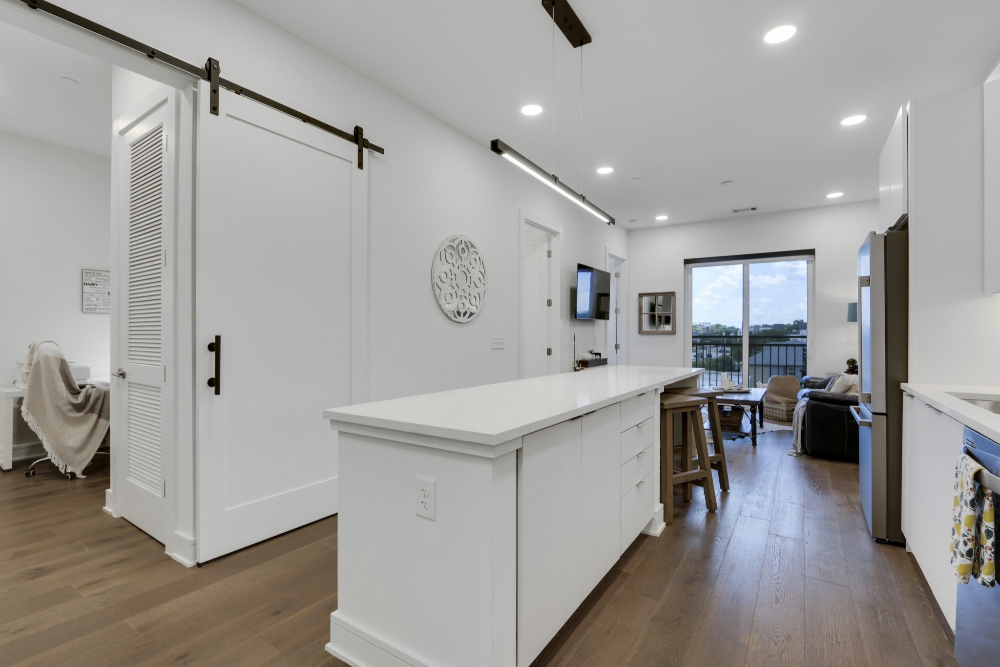 a kitchen with a refrigerator and a stove