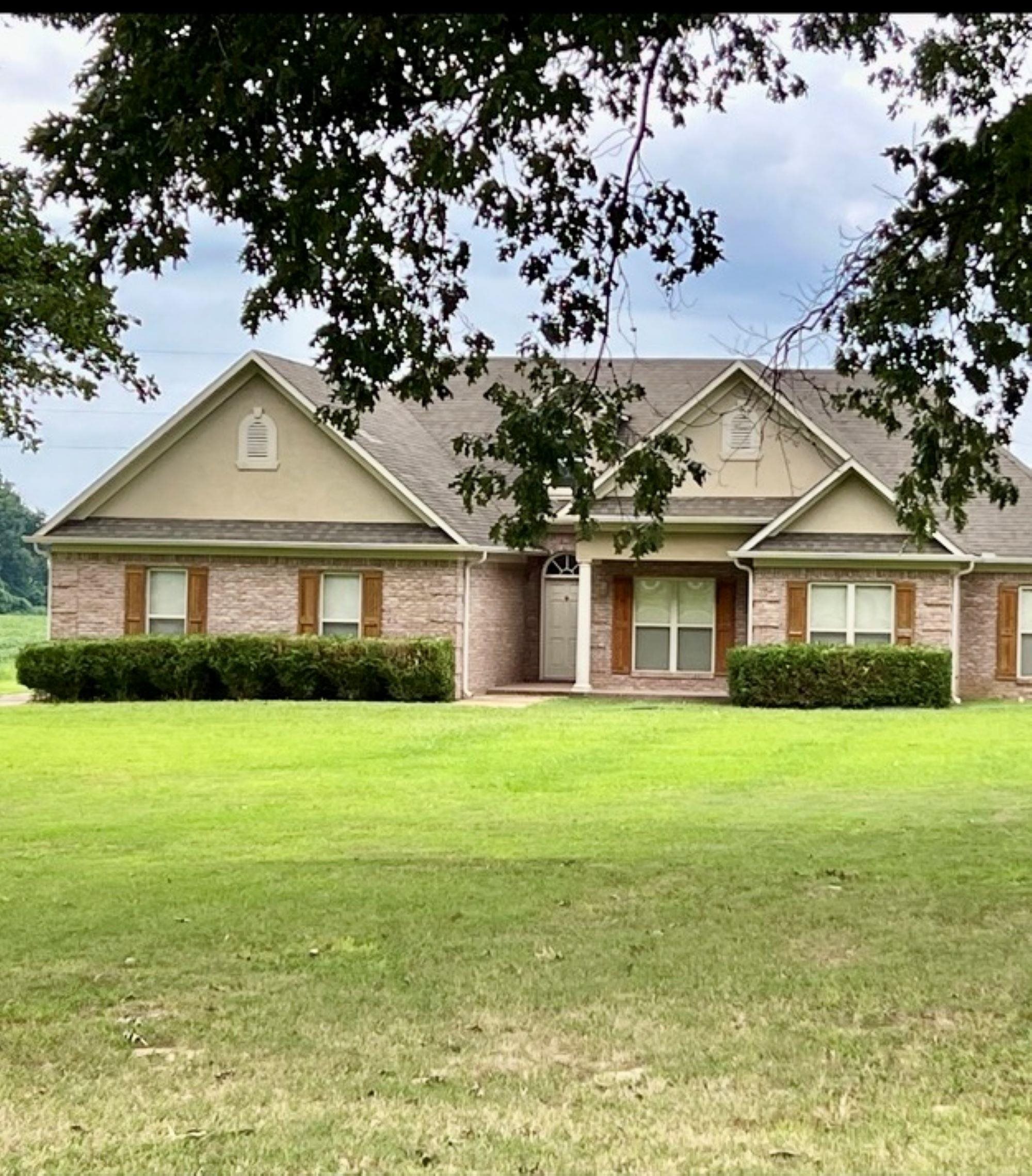 View of front of property with a front lawn