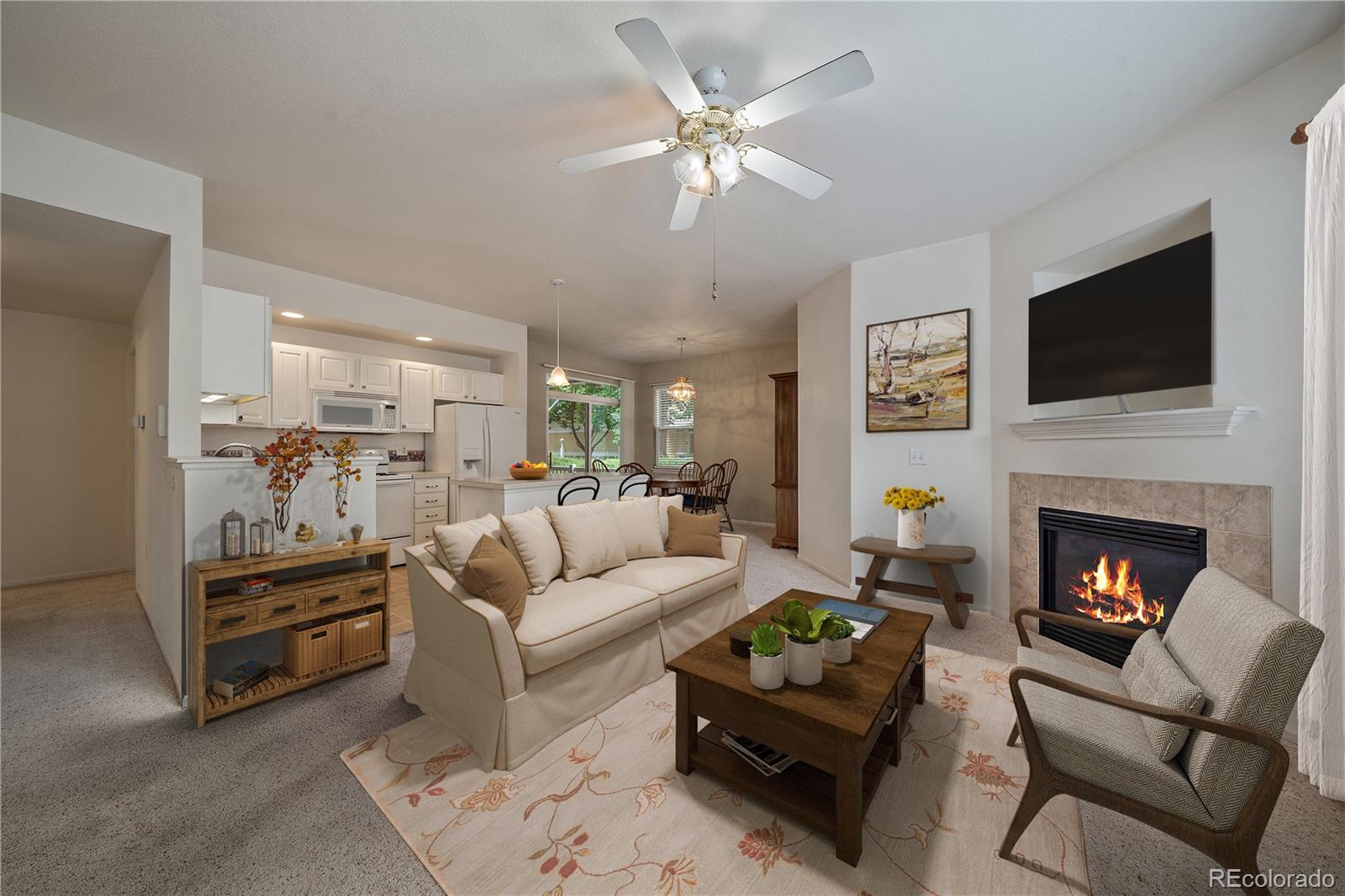 a living room with furniture fireplace and a flat screen tv