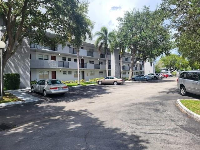 a view of street with parked cars