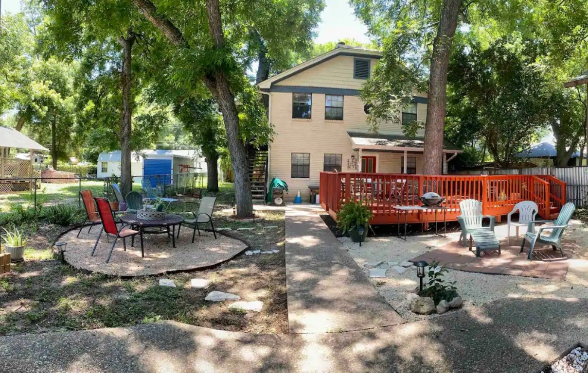 a view of a house with backyard sitting area and furniture