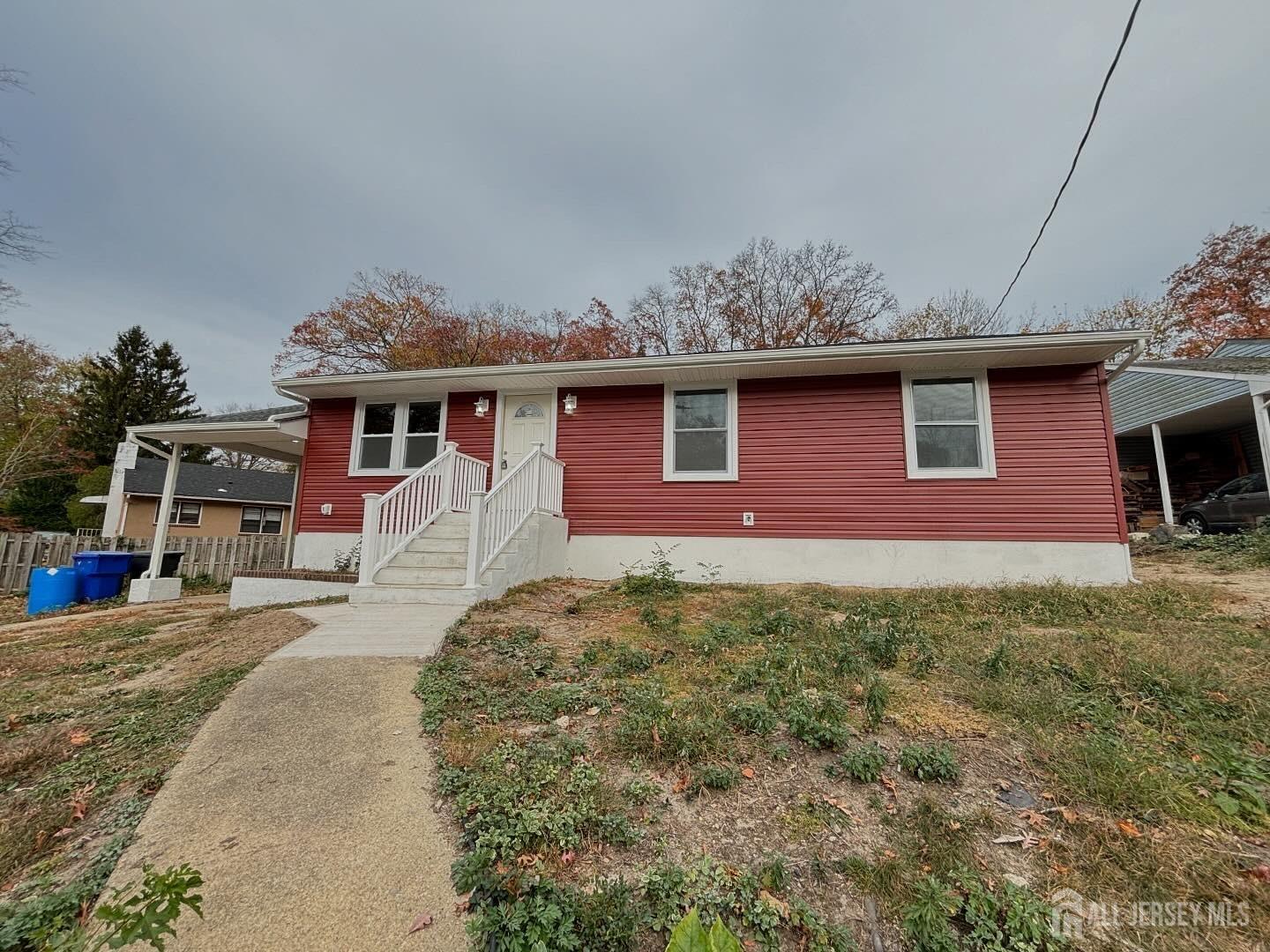 a front view of a house with yard