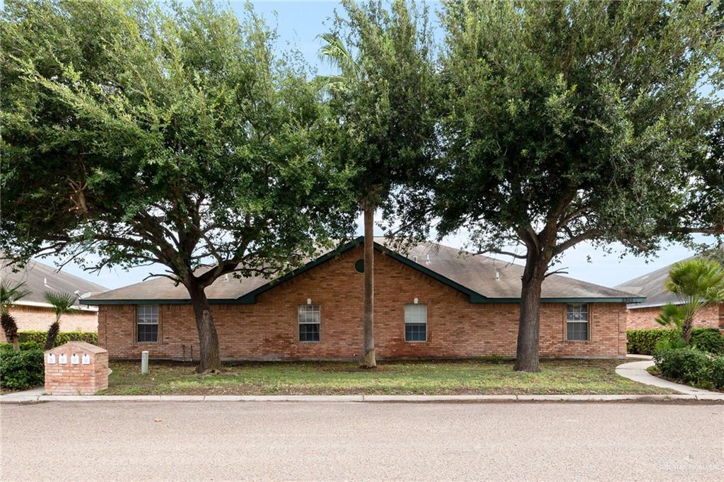 a house with a tree in front of it