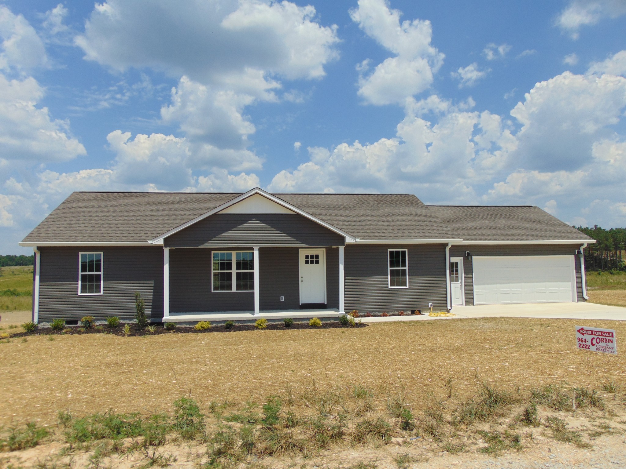 front view of a house with a yard