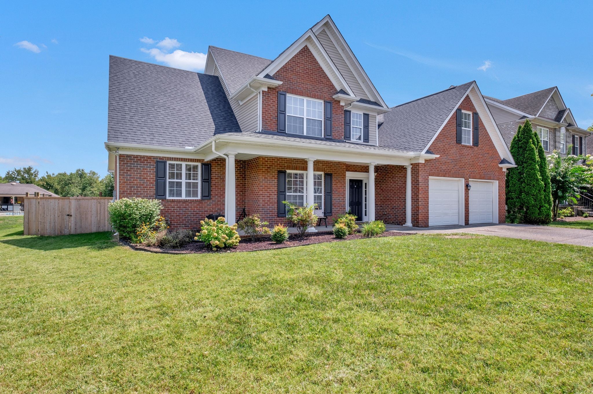 front view of a house with a yard