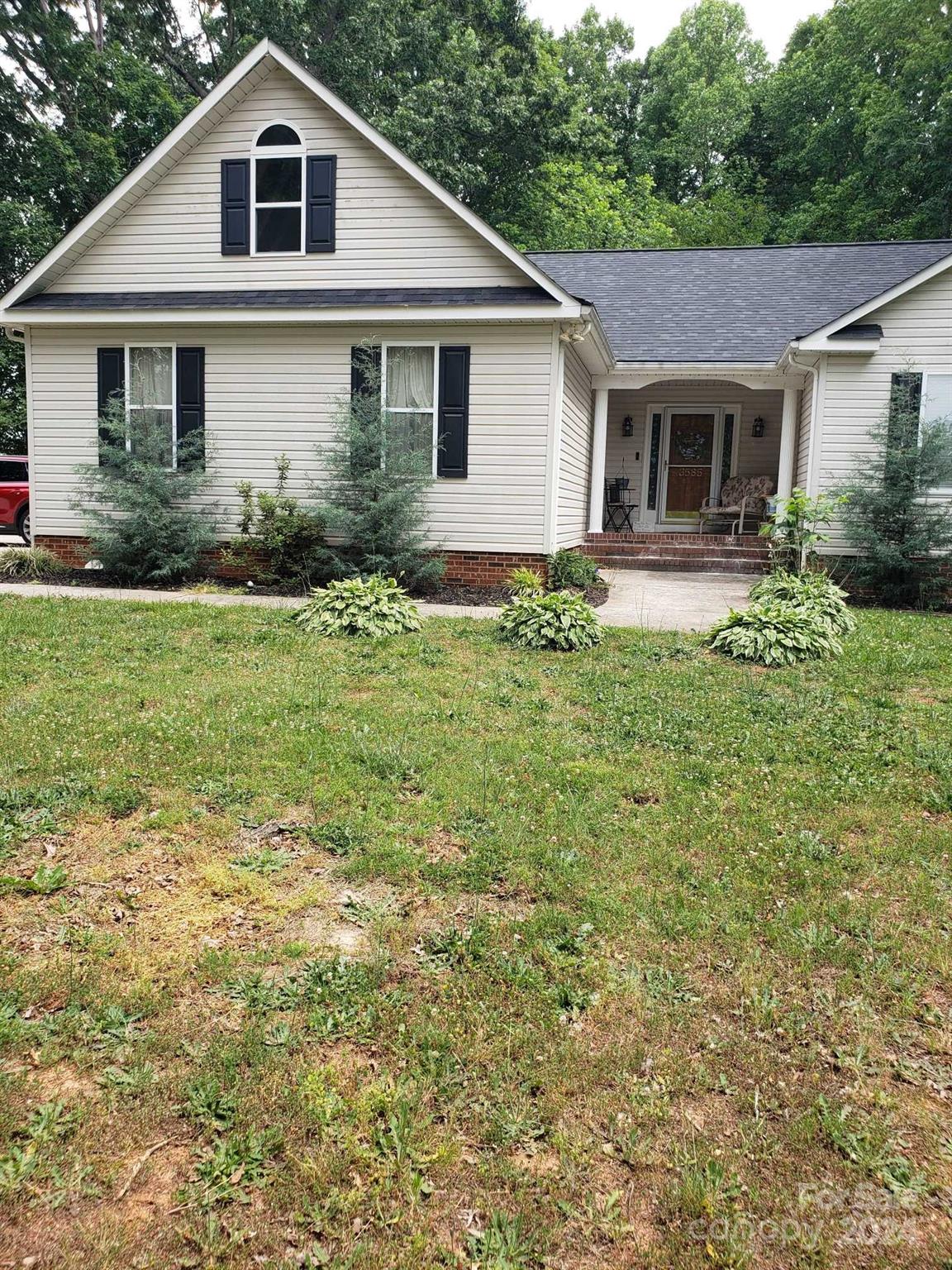 a front view of a house with a yard