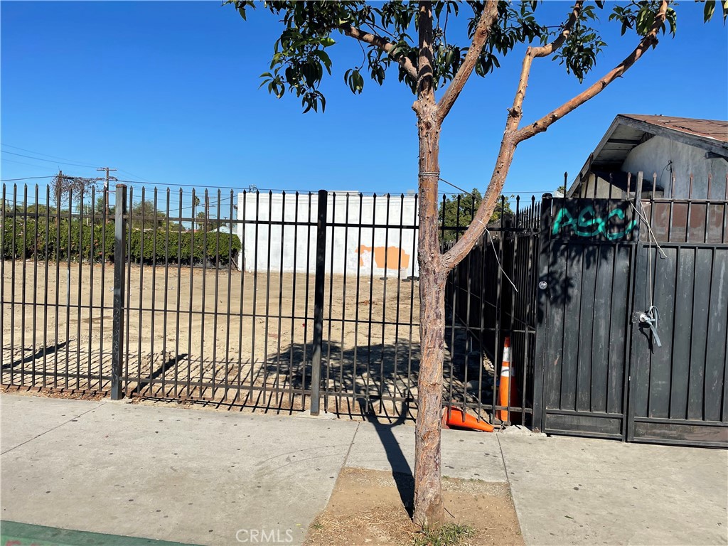 a view of a wrought iron fences in front of house