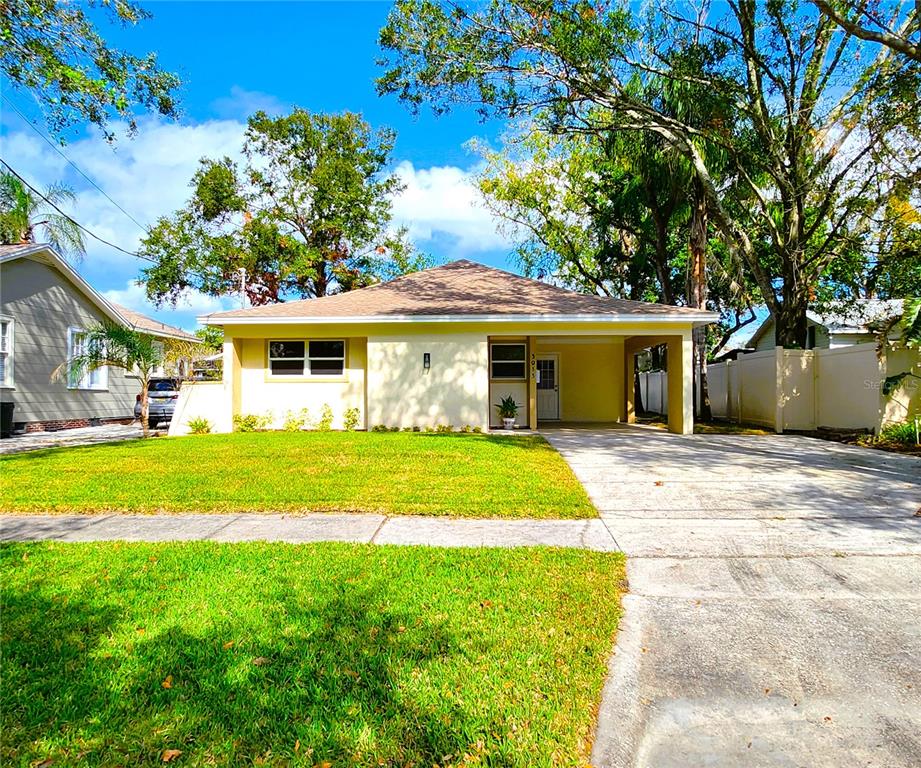 a front view of a house with a yard and porch