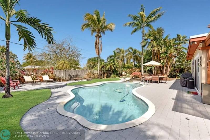 a view of a swimming pool with a house