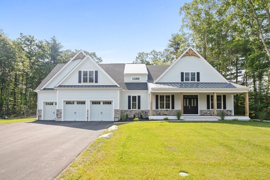 a front view of a house with swimming pool and porch