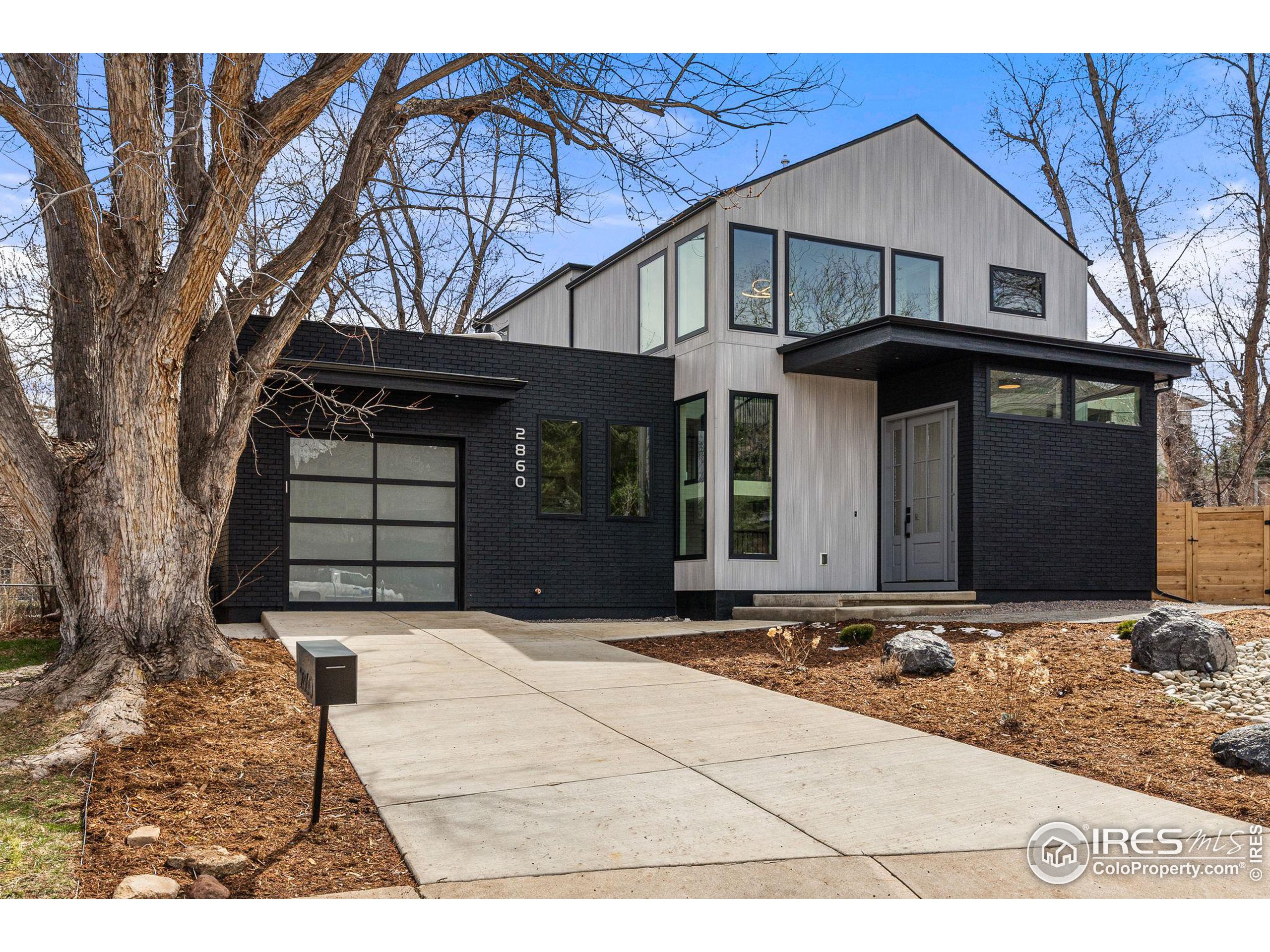 a front view of a house with garage