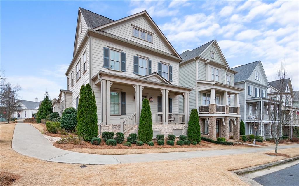 a front view of a residential apartment building with a yard