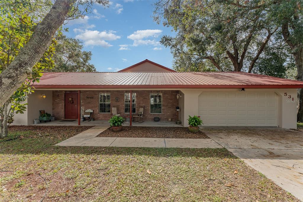 front view of a house with a patio