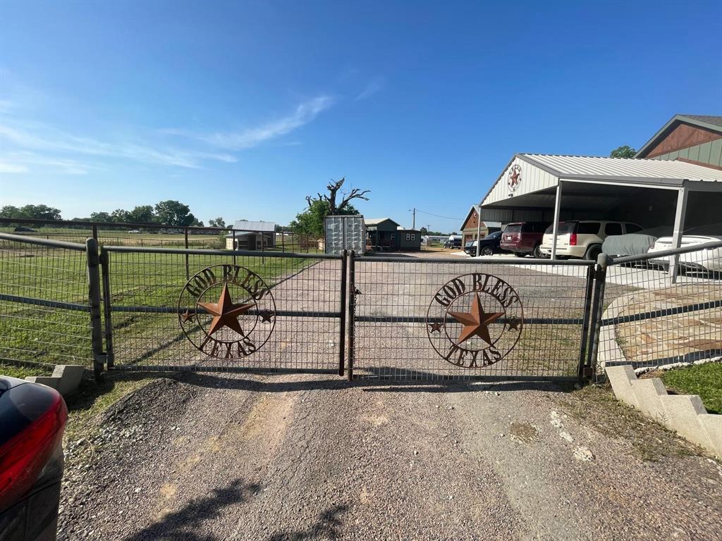 a view of a park with iron fence