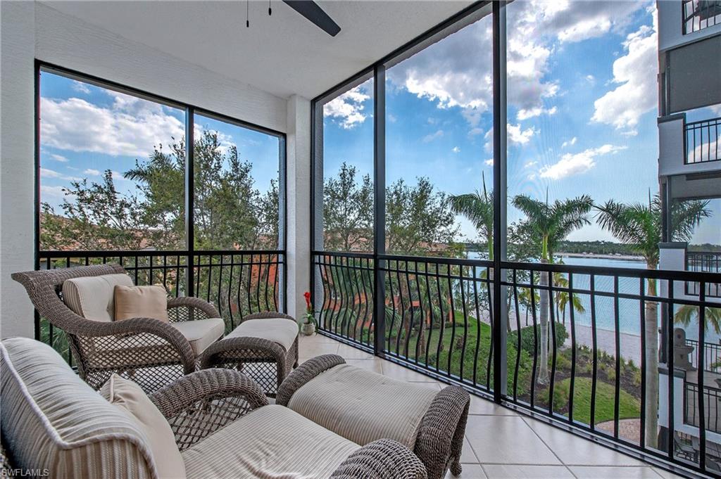 a balcony with furniture and a city view