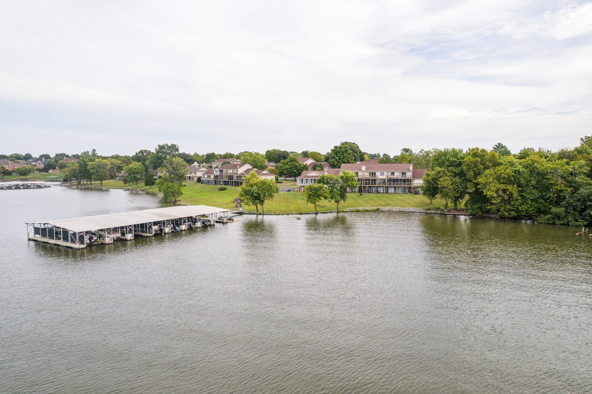 a view of a lake with houses in the back