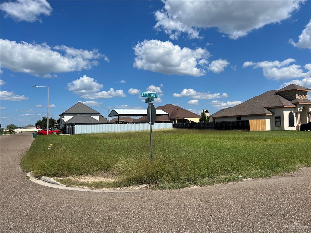 a view of a house with a big yard