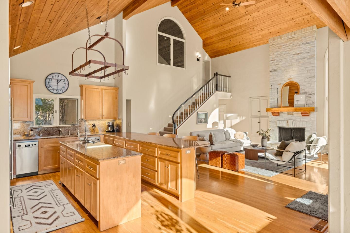 a kitchen with stainless steel appliances kitchen island granite countertop a sink and cabinets