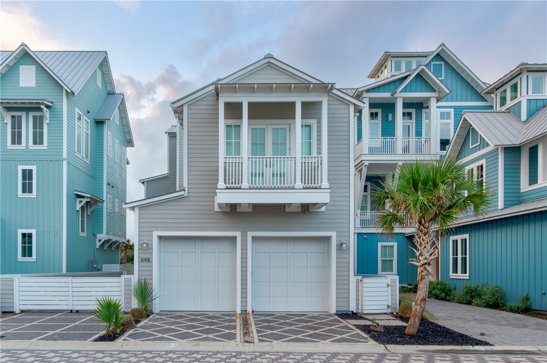 a front view of a house with garage