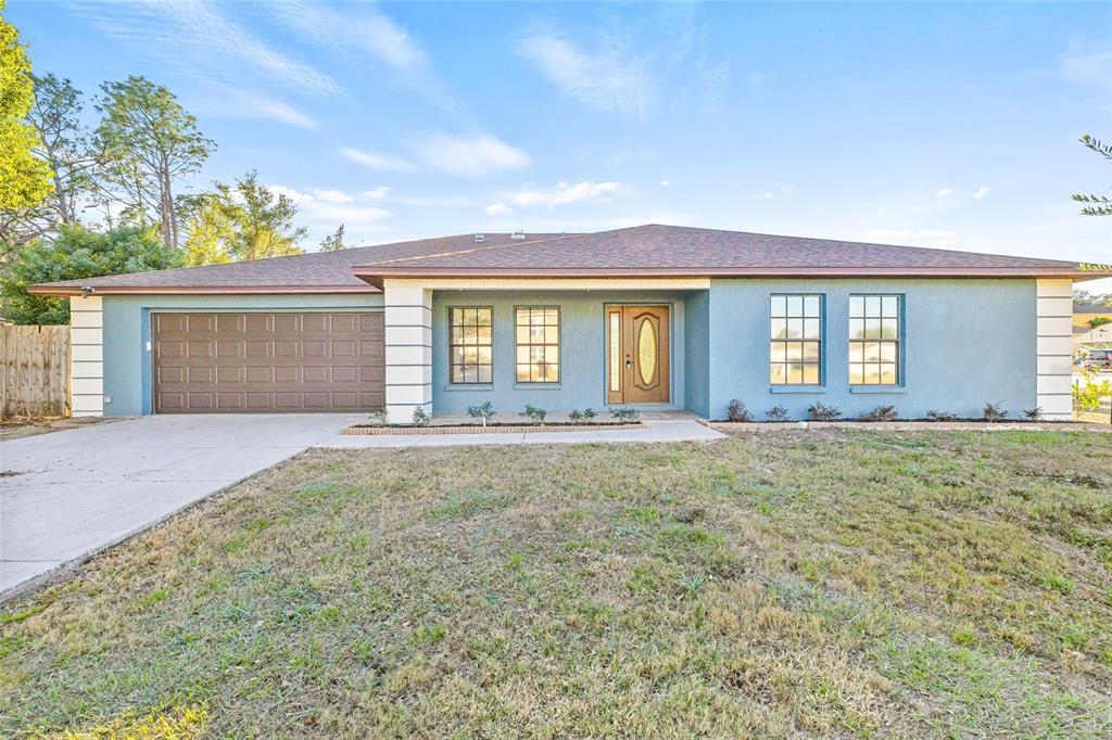 front view of a house with a yard