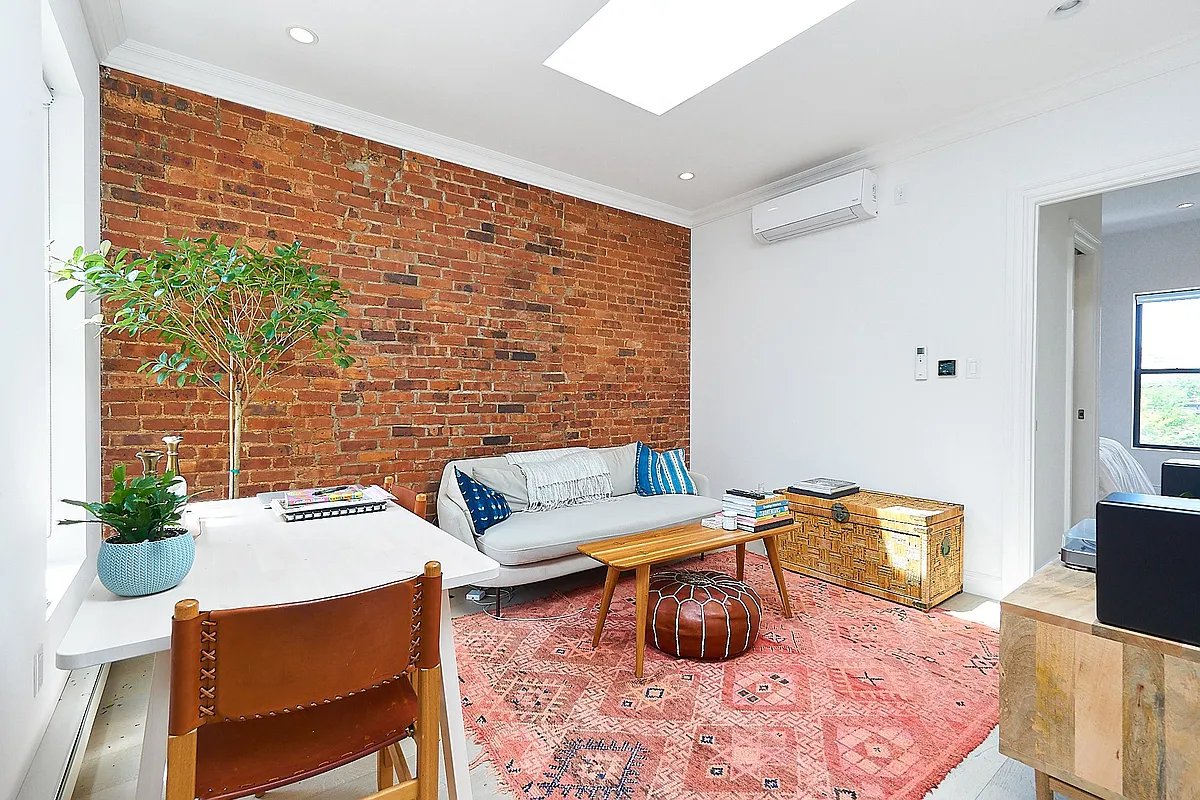 a view of a livingroom with furniture