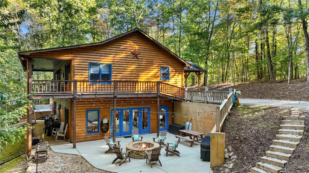 a view of an house with backyard space and sitting area