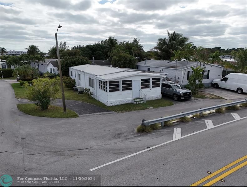 a picture of a building with a view of a big yard