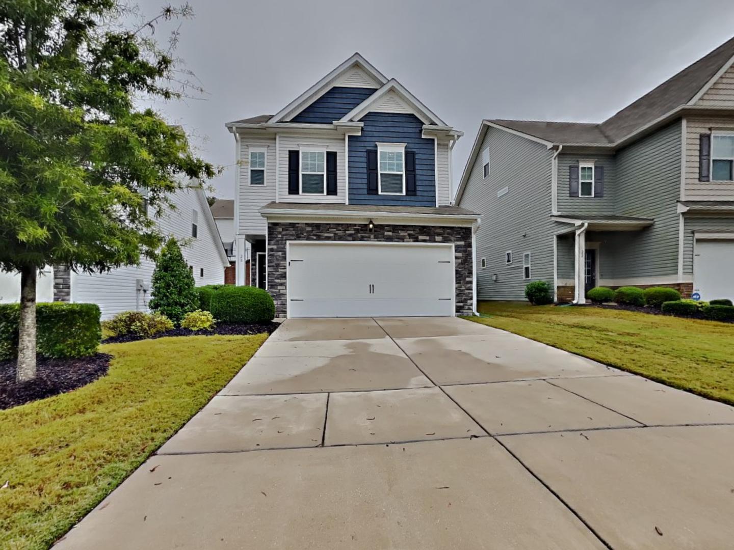 a front view of a house with a yard