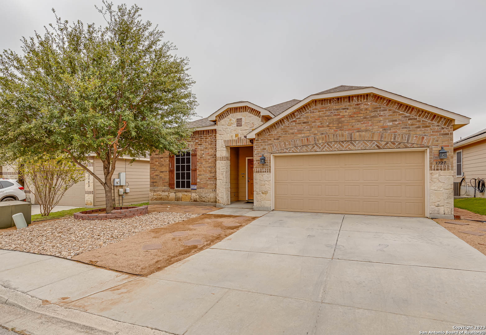 a front view of a house with a garage