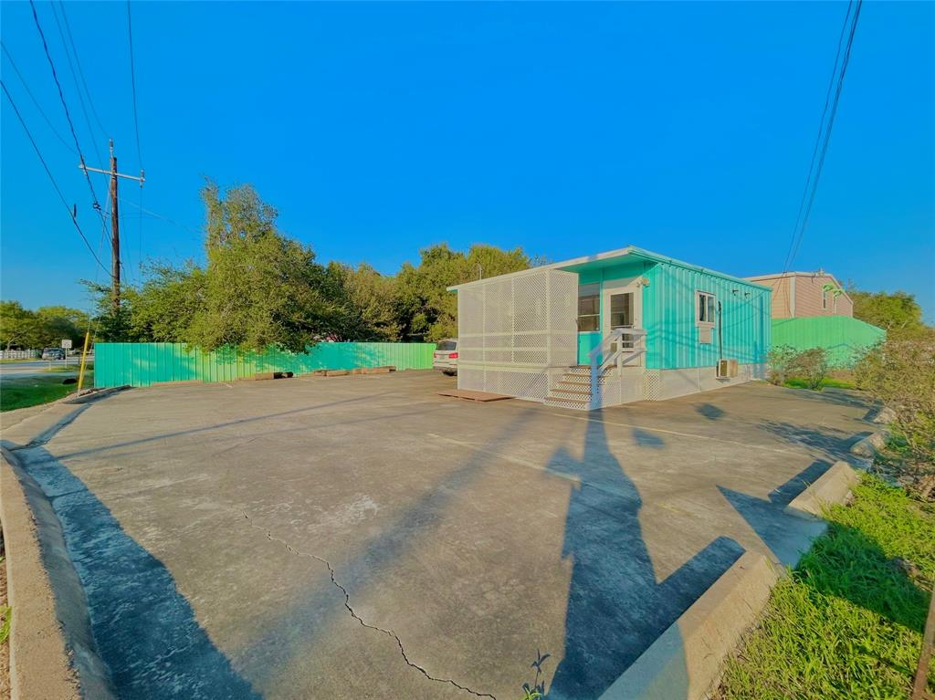 a view of a house with a yard and a garage