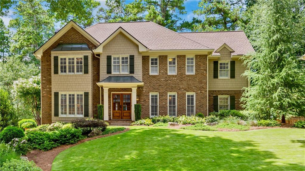 front view of a house with a yard