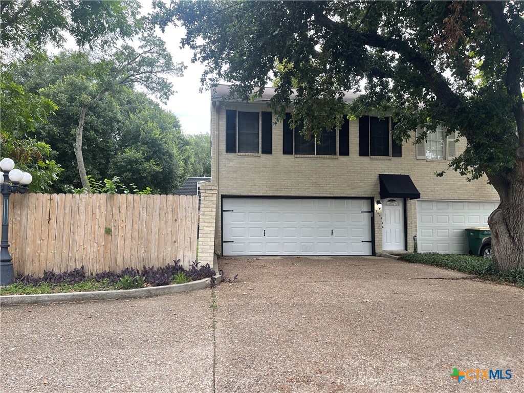 front view of a house with a street