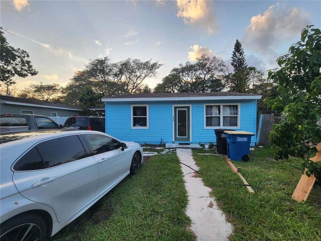 a view of house with backyard space and garden