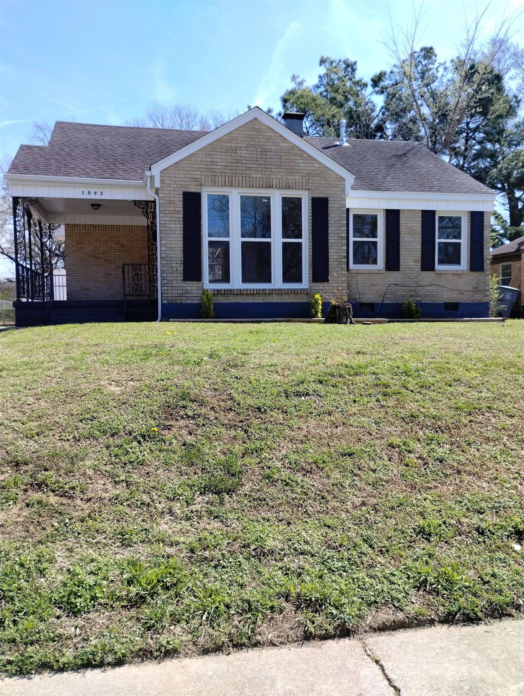 front view of a house with a yard