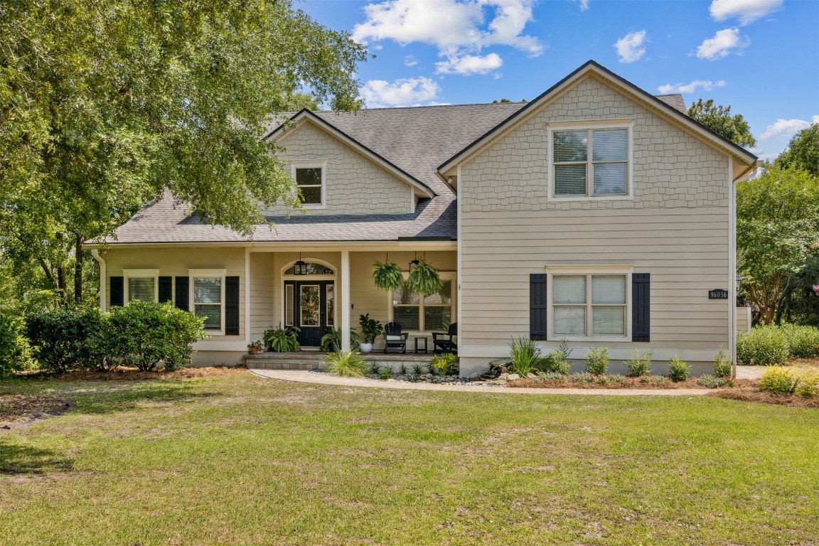 a front view of house with yard and green space