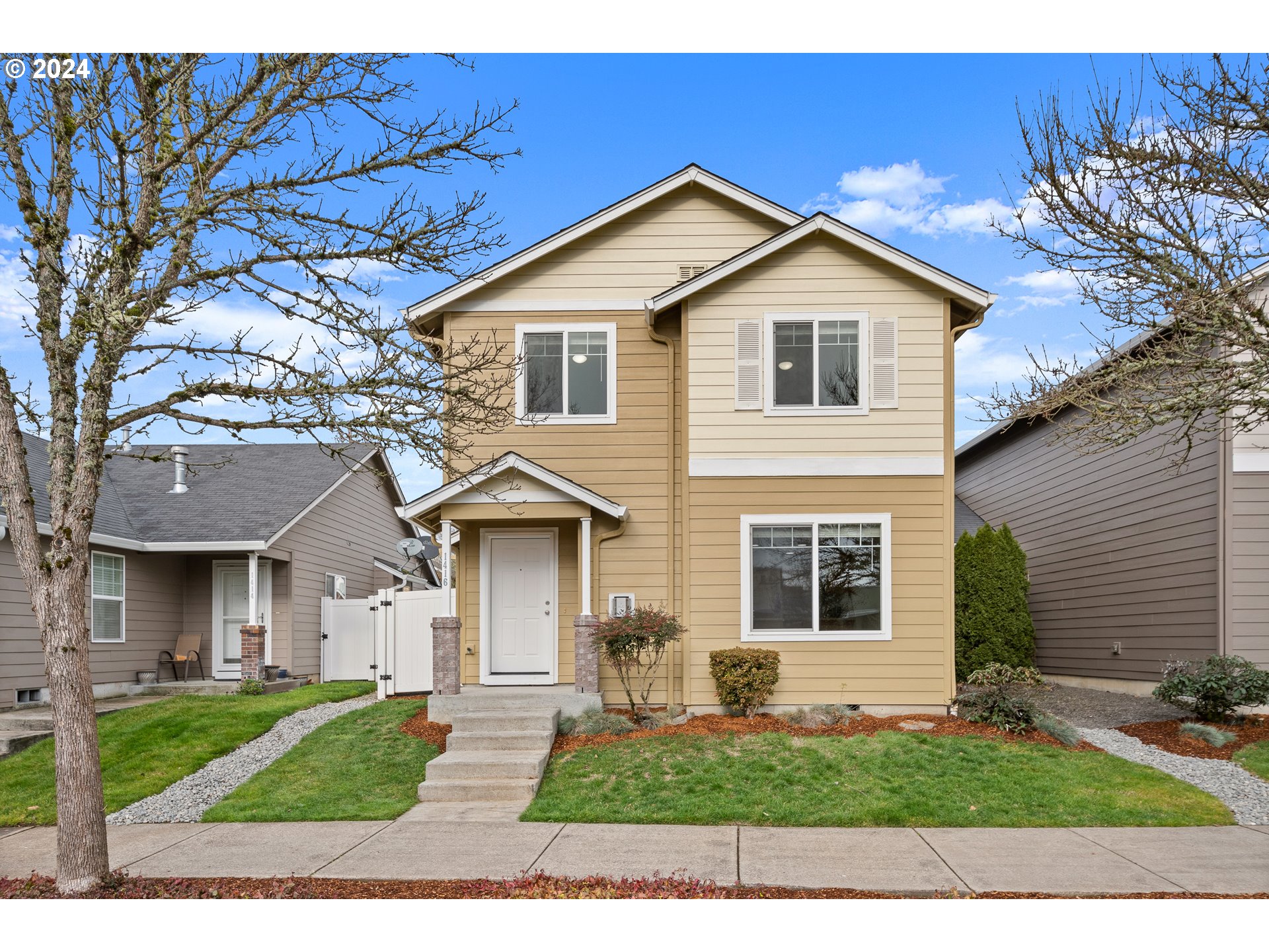 a front view of a house with a yard