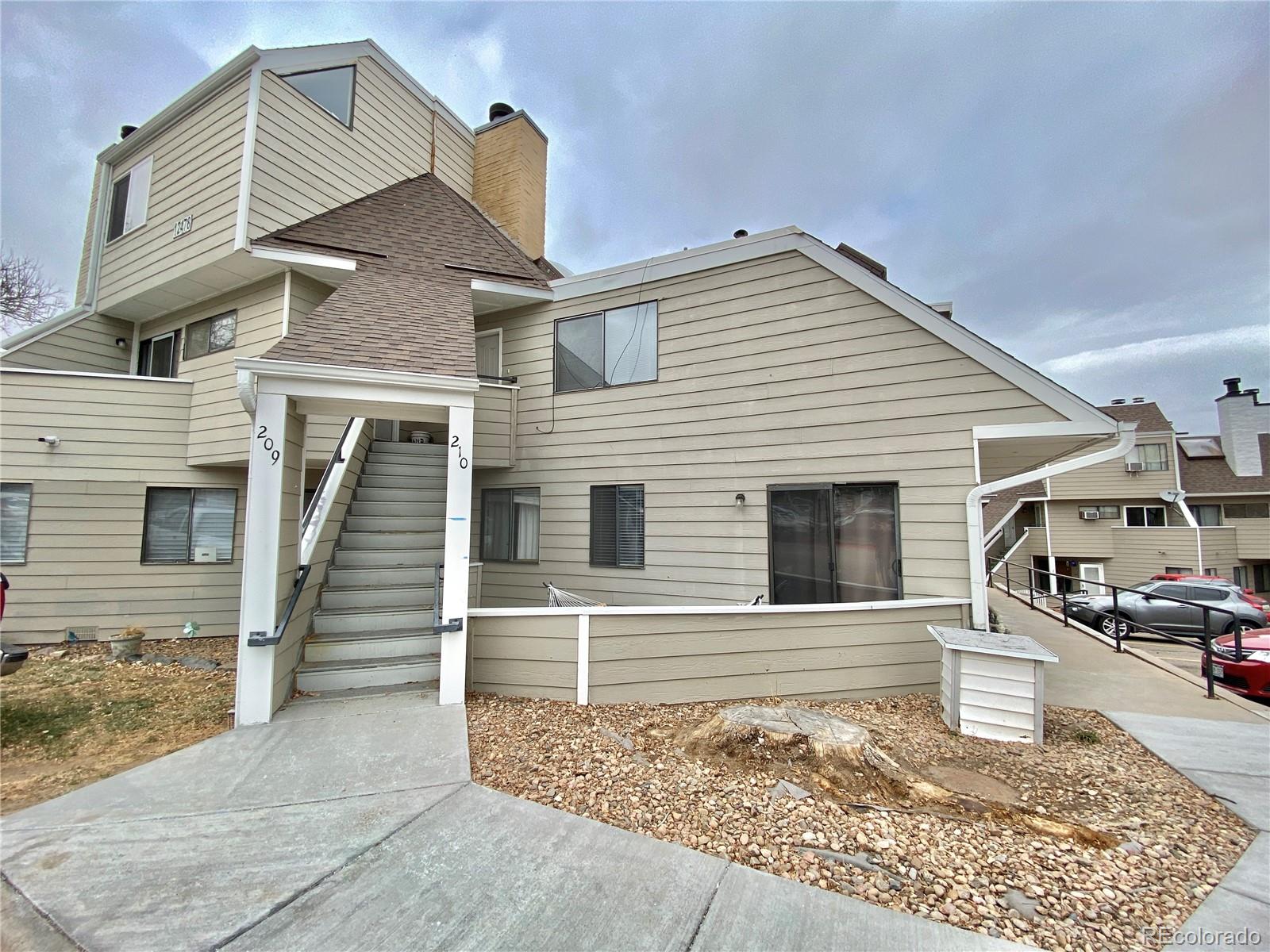 a front view of a house with garage