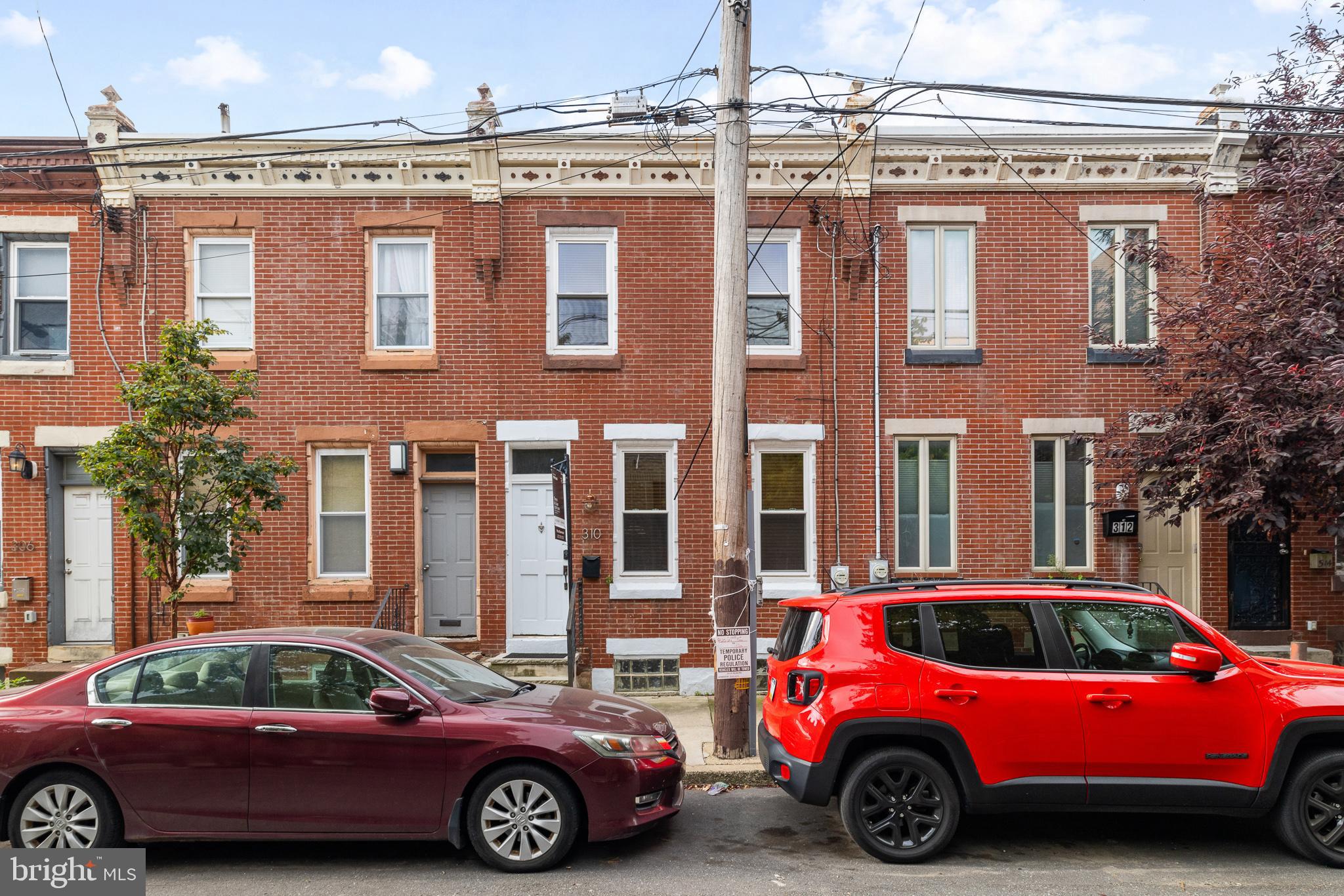 a front view of a house with parking space and parking space