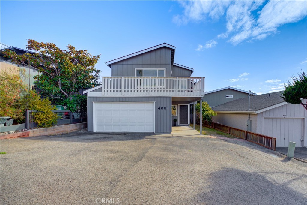 a front view of a house with a garage and a garage