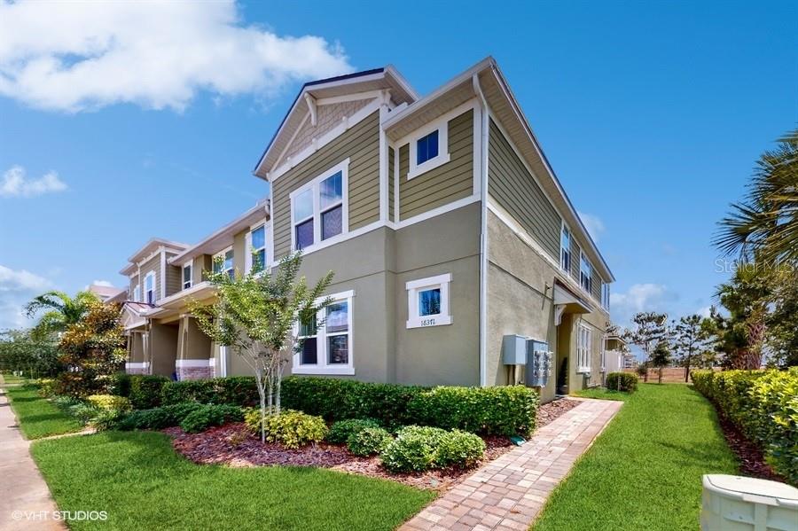 a front view of a house with a yard