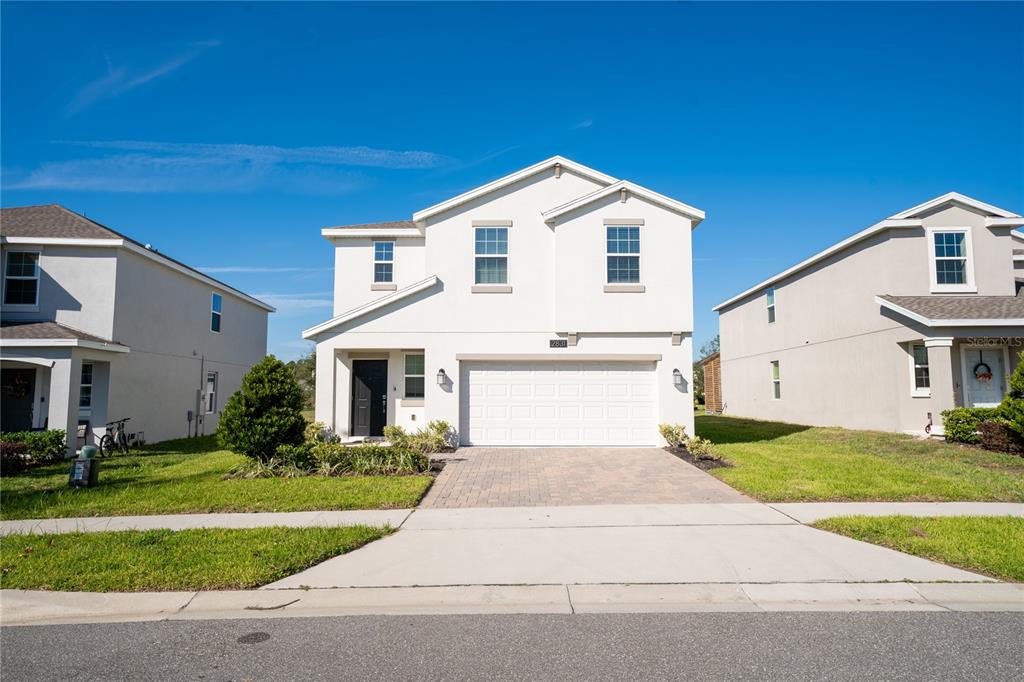 a front view of a house with a yard