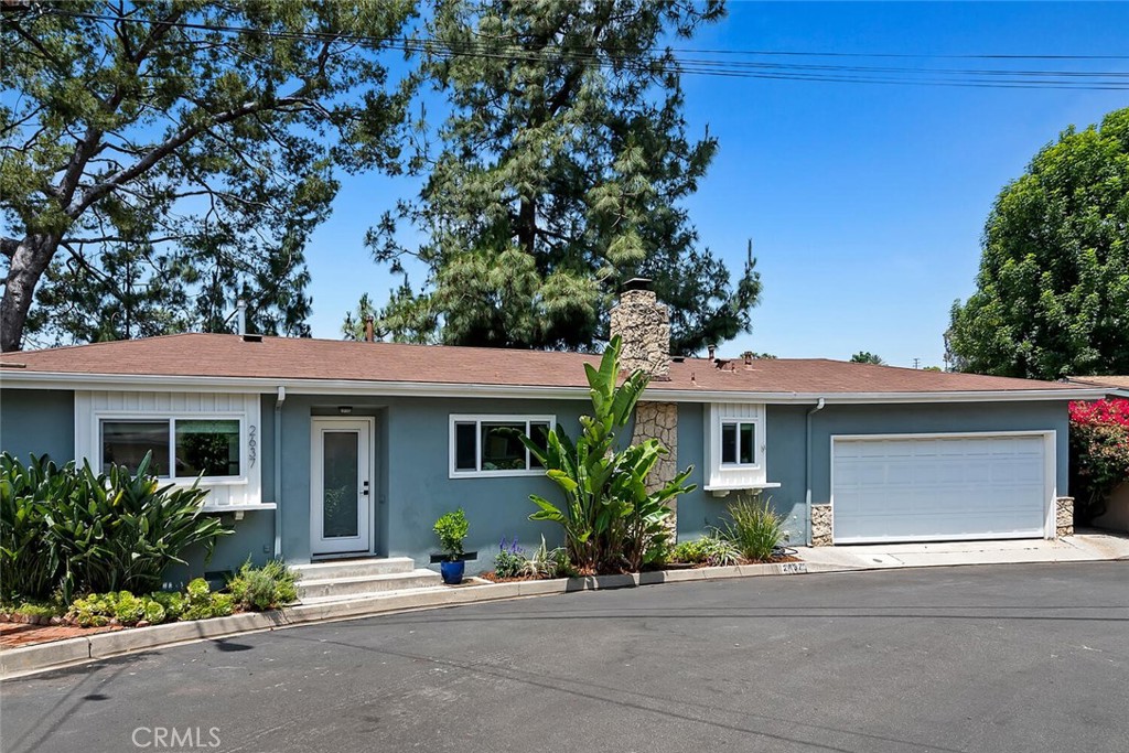 a front view of a house with a garage