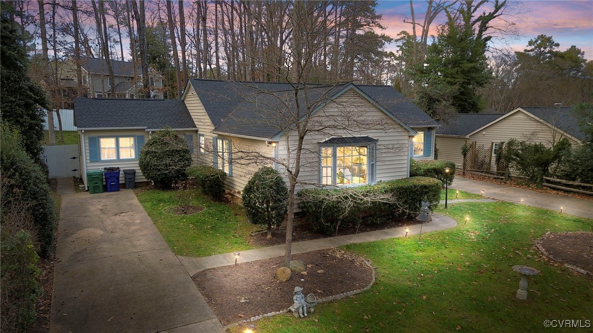 View of front of house with a yard