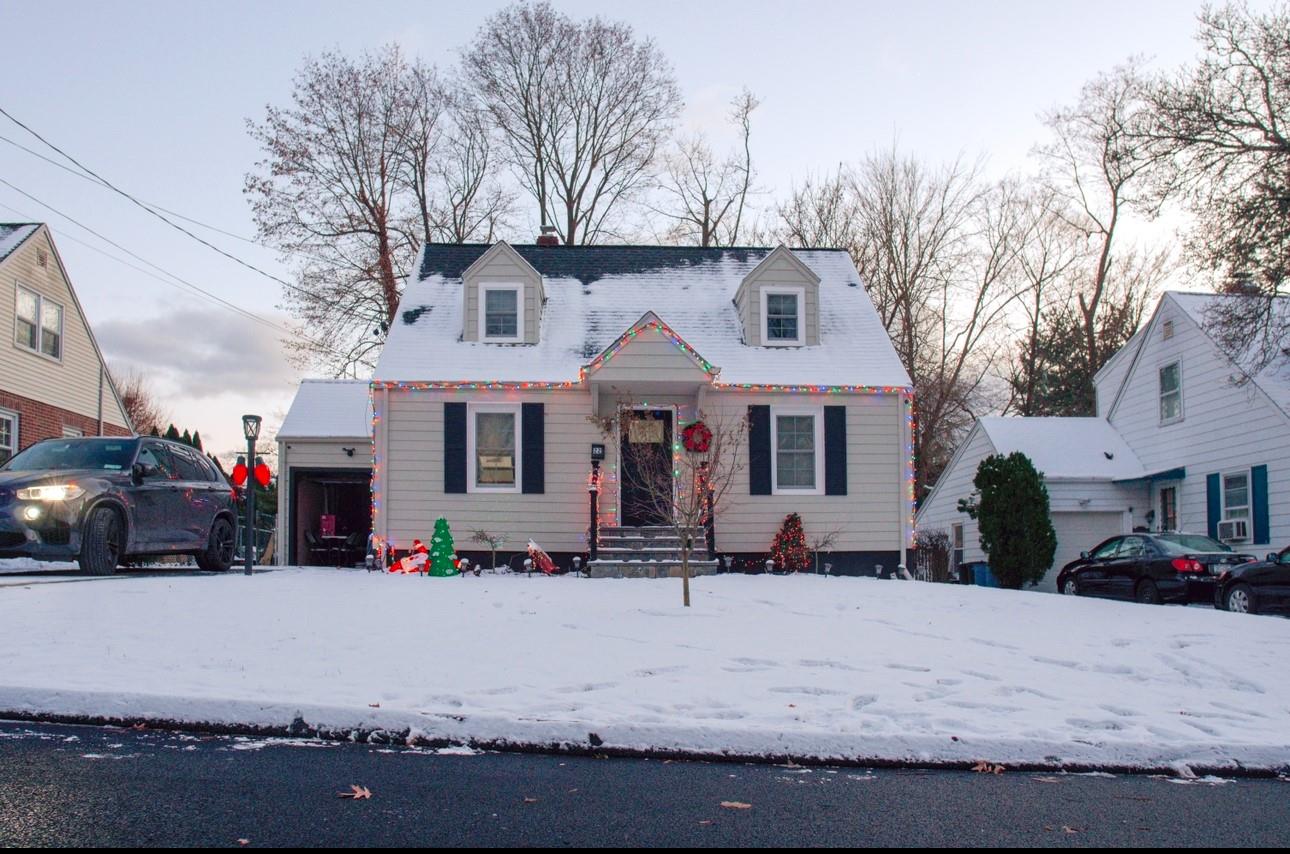 Cape cod-style house with a garage