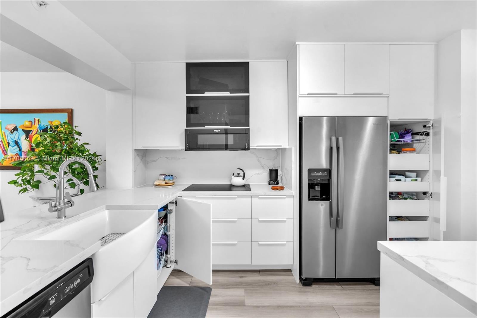 a kitchen with a sink and a refrigerator