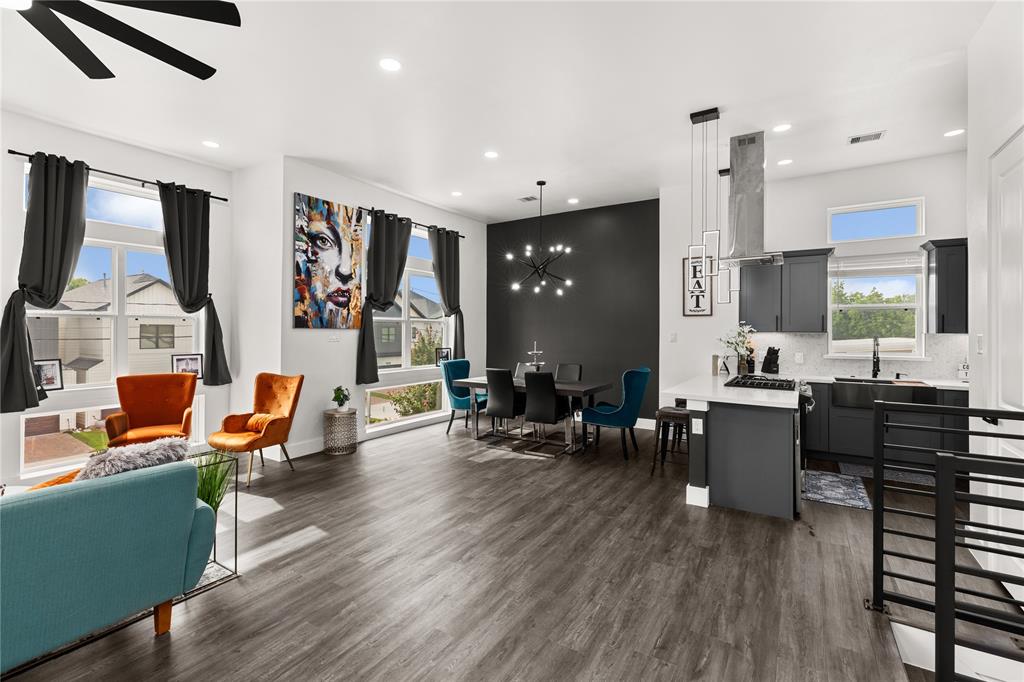 a living room with furniture and kitchen view