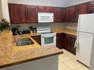 a kitchen with a sink a stove and refrigerator