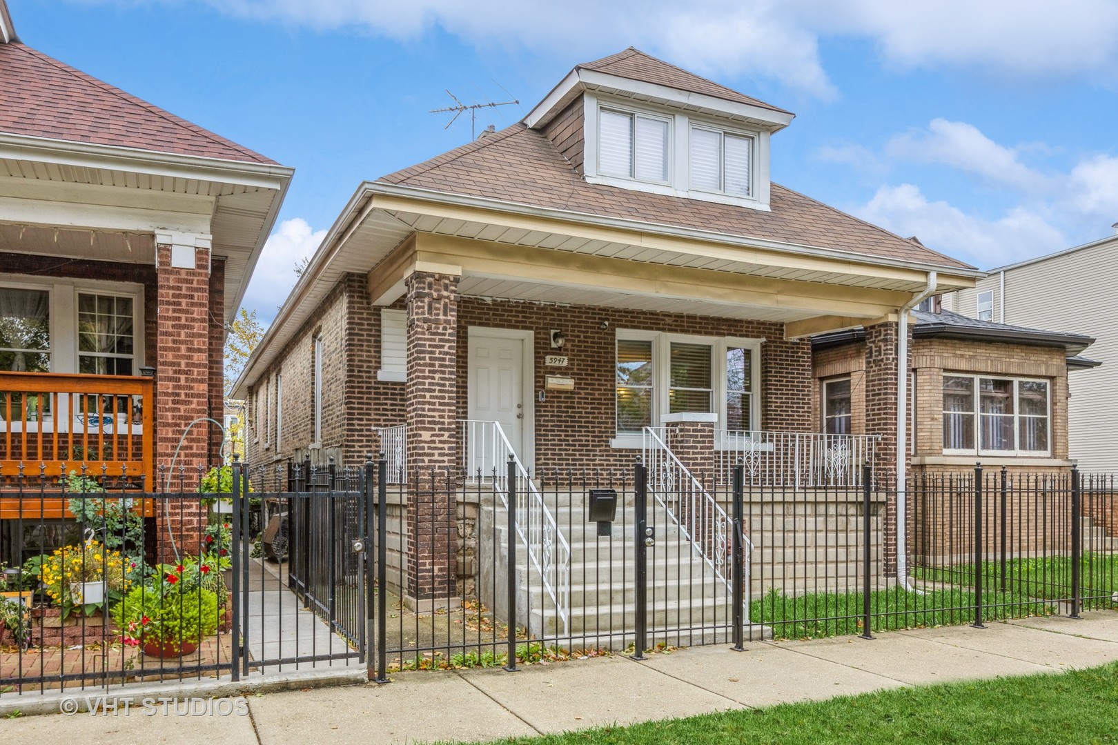 a front view of a house with a porch