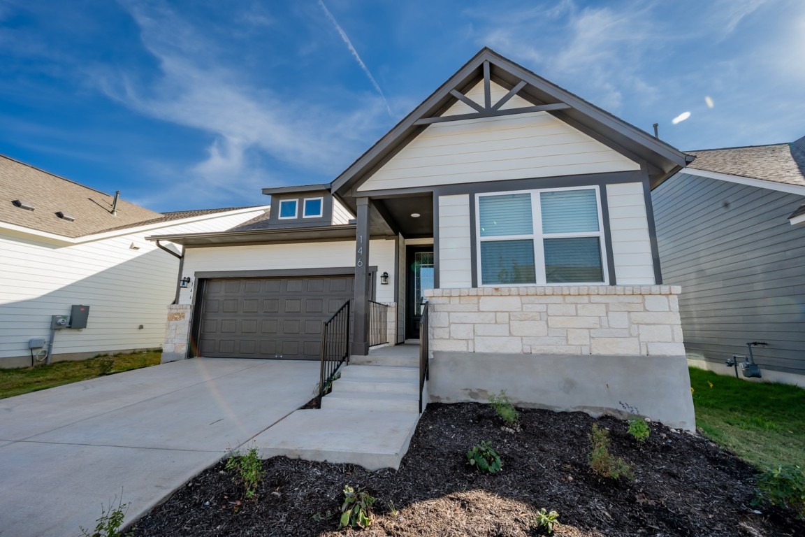 a front view of a house with garage