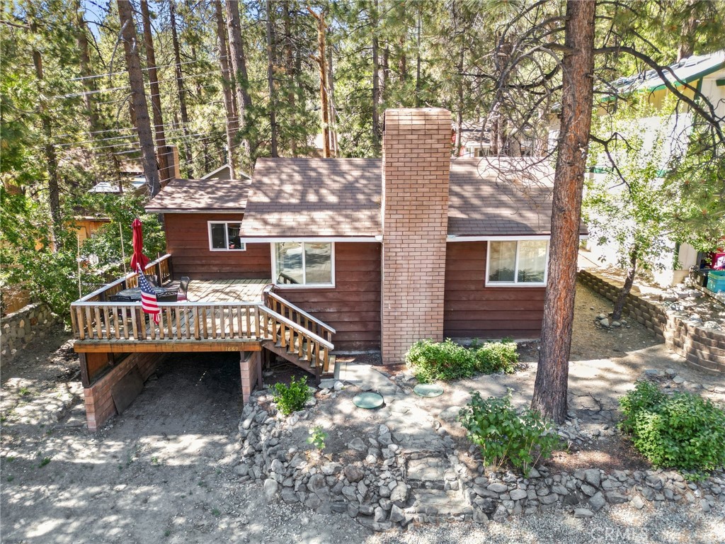 a view of a house with a yard and balcony